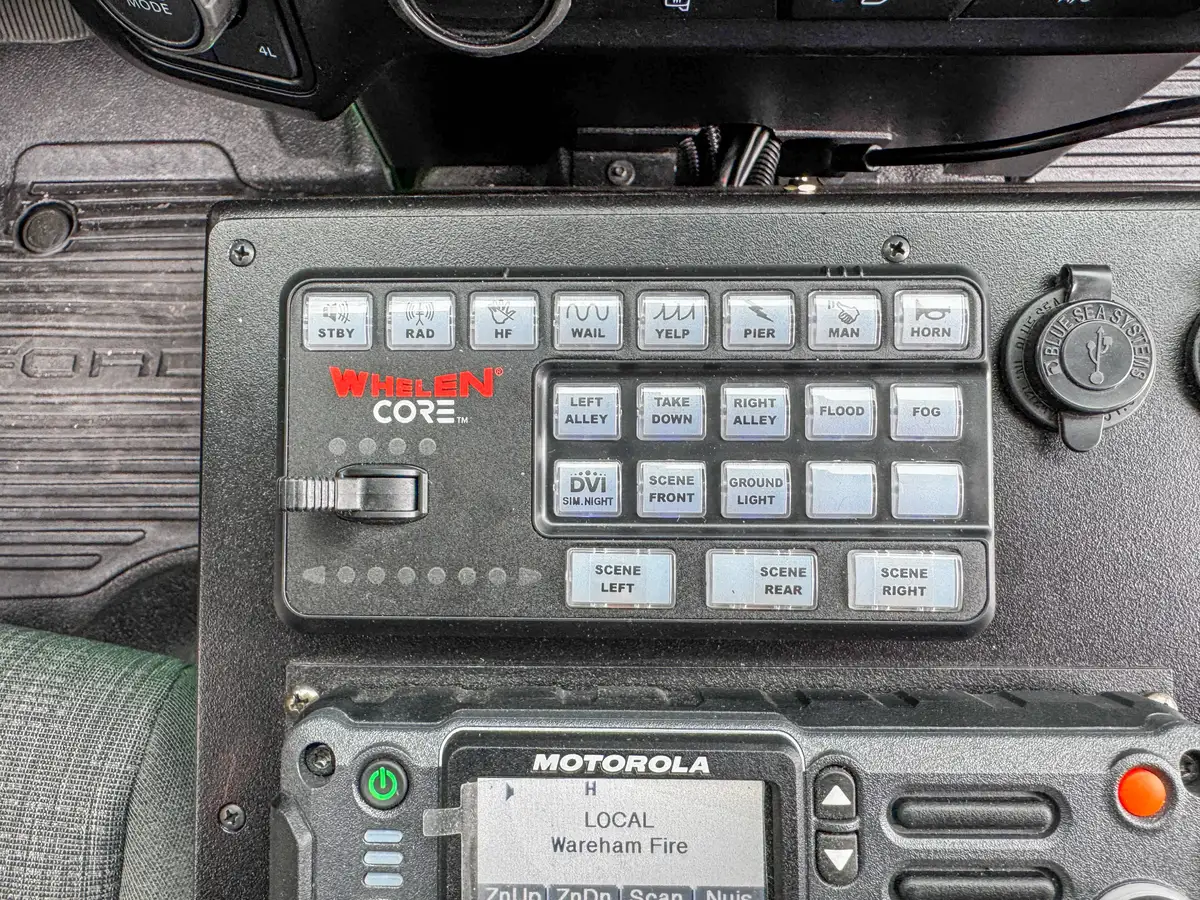 Rear cabin view showing front seats, center console, and dashboard.
